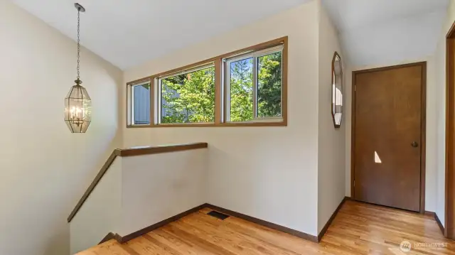 Upper floor hallway and door to amazing storage