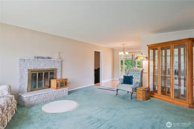 Walking in to see plenty of room to visit - and a view of the door to another Living area ...