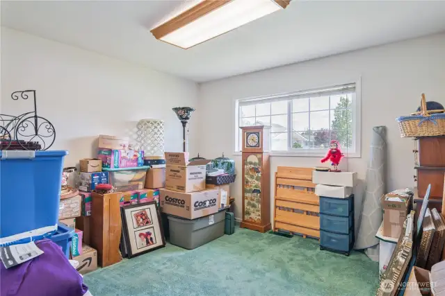 Bedroom 3 is the 'holding' area for the move - with light from the good-sized front window