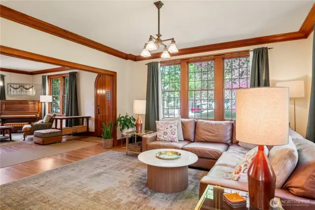 Notice the beautiful windows and lovingly refinished, original floors and moldings.