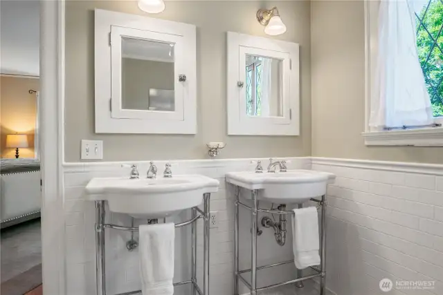 Double sinks and medicine cabinets.