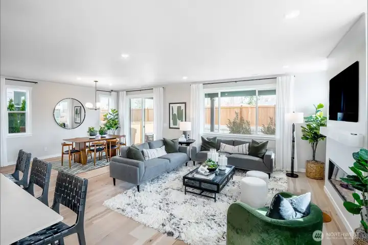 Open layout great room, dining room and kitchen. Photos not of this home