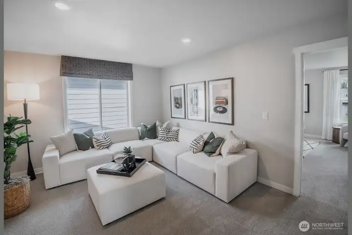 Open loft on upper level. Photos not of this home