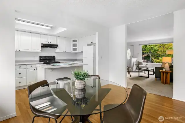 Dining room with kitchen and view into living room