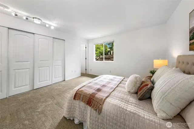 Primary bedroom with double closet and attached full bath