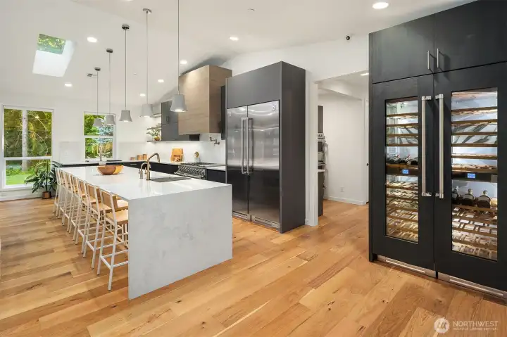 Top-tier Hestan appliance package features a 54" refrigerator/freezer, dual fuel range, 48" wine column, microwave drawer, and two dishwashers—designed for the ultimate culinary experience
