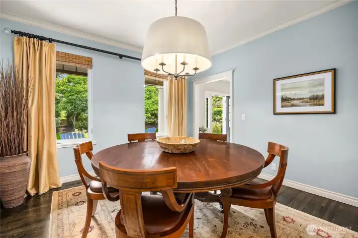 The formal dining room with custom lighting.