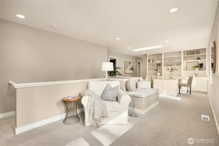 The upper level has a large flex space landing with custom built-ins, study space and tons of light.