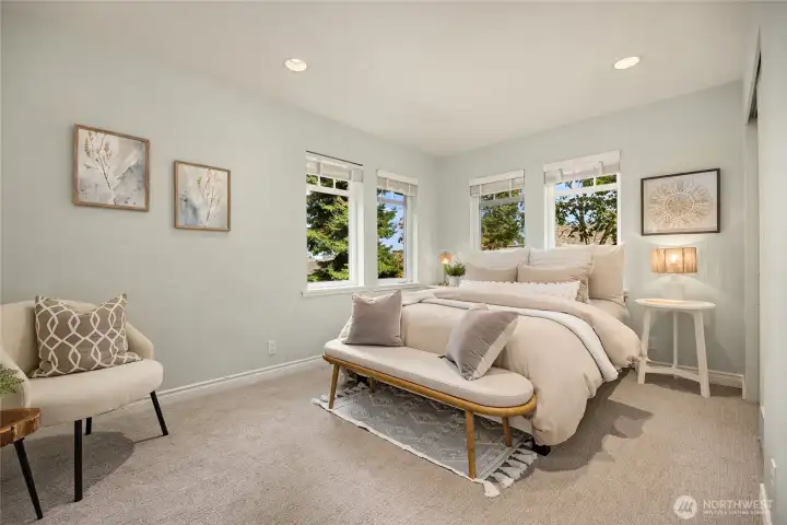 The third bedroom on the upper level has peek-a-boo views of the Sound.