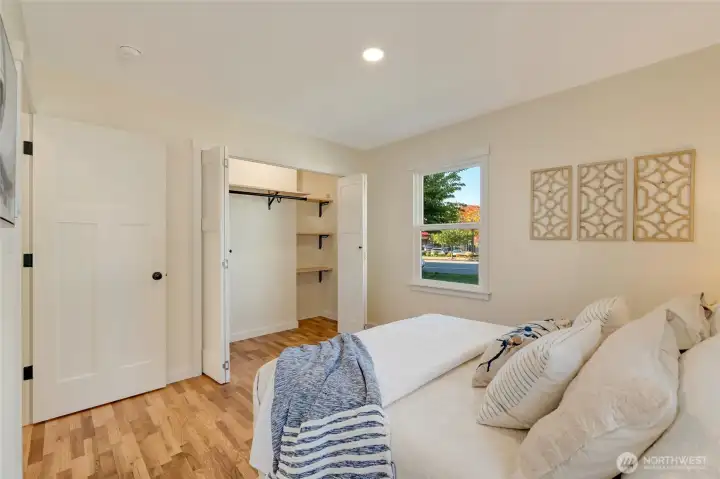 Primary closet with added shelving for media components.