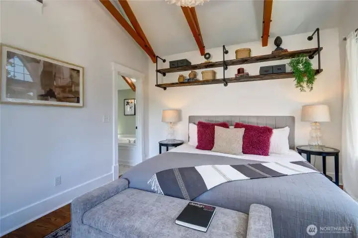 Primary bedroom with an adjoining bathroom