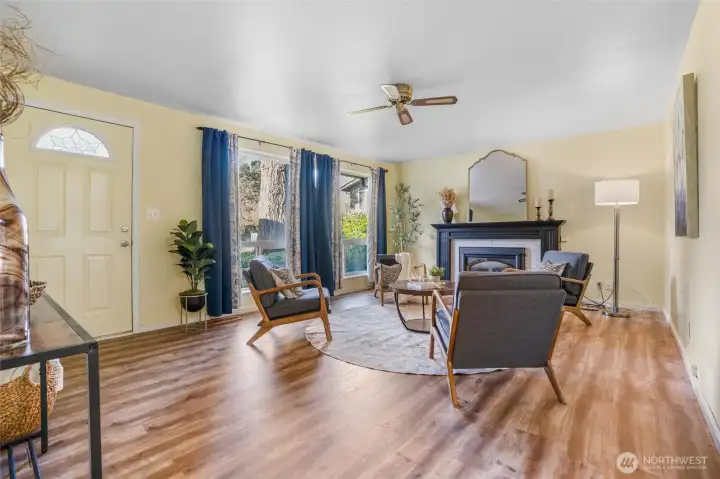 Welcome in the front door to your cozy living room with gas fireplace.