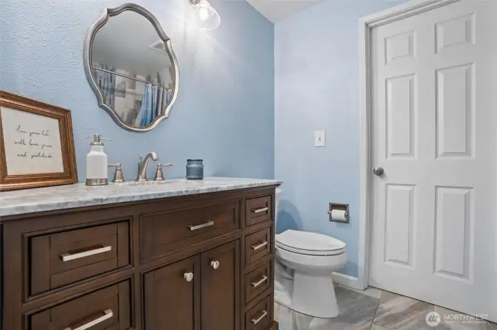 Main floor main bathroom.  The door leads to a mudroom.