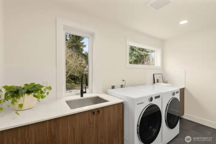 Large laundry room with washer and dryer.