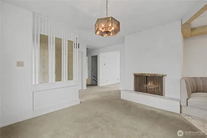 Fireplace in the dining room that connects to kitchen and living