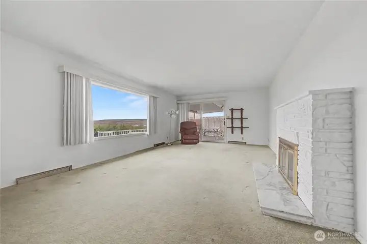 Living room has large windows to take in the views.