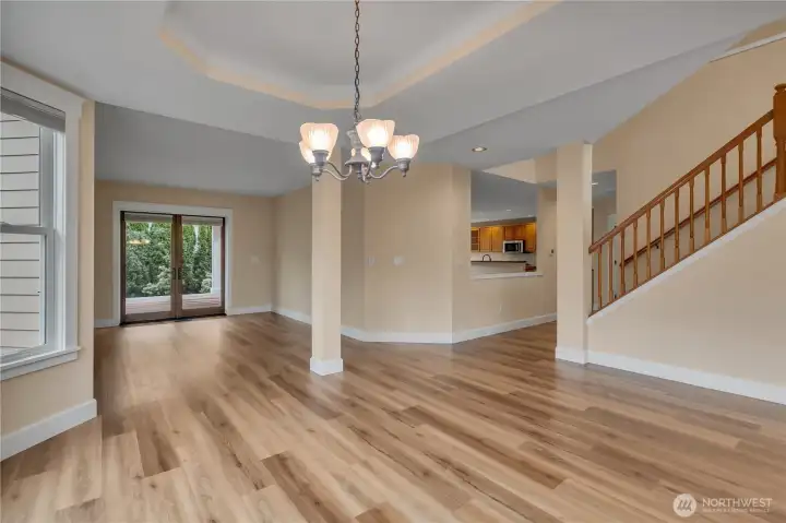 Dining Room facing Living Room. Laminated French-Doors open to the back deck.