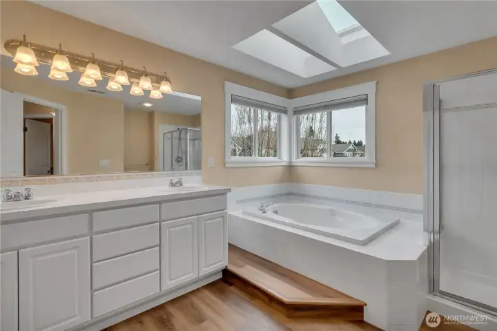 Connected Primary Bath Features a powered Skylight which opens for extra ventilation, has remote controlled blinds, and rain detection to close automatically!