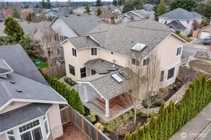 Yard has been professionally landscaped and maintained with flagstone walkways and standoffs for future yard lights.