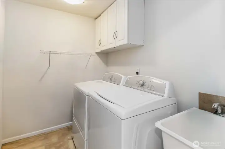 Laundry room with cabinets