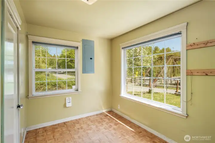 2nd bedroom is very bright with laminate flooring and views of Deer Creek.