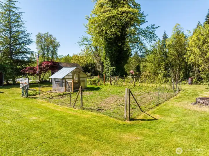 Large garden space just waiting for you to add vegetables or more berry plants.