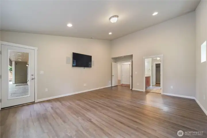 Primary bedroom with access to back patio.