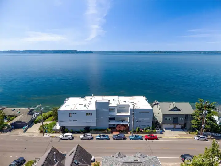 Waterfront living at its finest! Welcome to 4163 Beach Drive SW, Unit #102—a rare two-level waterfront condo offering seamless indoor-outdoor living. Enjoy your private waterfront patio and grassy yard with breathtaking views of Blake Island and the Olympic Mountains right outside your door. Waterfront living at its finest! Welcome to 4163 Beach Drive SW, Unit #102—a rare two-level waterfront condo offering seamless indoor-outdoor living. Enjoy your private waterfront patio and grassy yard with breathtaking views of Blake Island and the Olympic Mountains right outside your door.