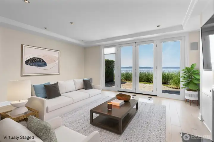 Seamlessly blend indoor and outdoor living with direct access to your private waterfront patio, an ideal setting for effortless entertaining and everyday relaxation. The home's impressive tray ceilings and tall ceiling heights add architectural character while filling the space with light and volume. Seamlessly blend indoor and outdoor living with direct access to your private waterfront patio, an ideal setting for effortless entertaining and everyday relaxation. The home's impressive tray ceilings and tall ceiling heights add architectural character while filling the space with light and volume.