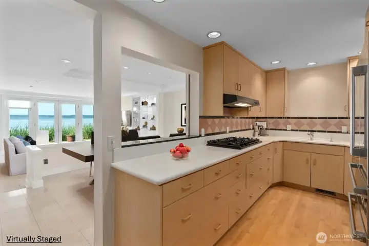 The well-appointed kitchen features gas cooking, abundant light cabinetry, and the convenience of two dishwashers. Best of all, you can enjoy beautiful water views while preparing meals. The well-appointed kitchen features gas cooking, abundant light cabinetry, and the convenience of two dishwashers. Best of all, you can enjoy beautiful water views while preparing meals.
