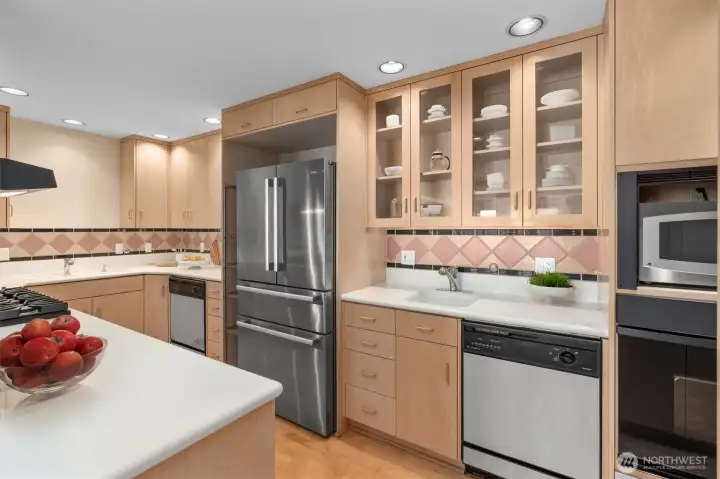 Stainless steel appliances, glass-paneled cabinetry, and dual dishwashers make this an entertainer’s dream. Stainless steel appliances, glass-paneled cabinetry, and dual dishwashers make this an entertainer’s dream.