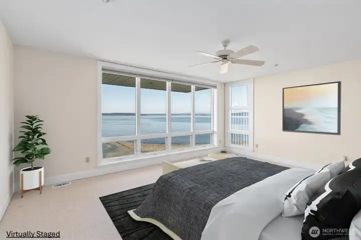 The view-facing primary suite features floor-to-ceiling windows that frame breathtaking sunsets over the Olympic Mountains. The view-facing primary suite features floor-to-ceiling windows that frame breathtaking sunsets over the Olympic Mountains.