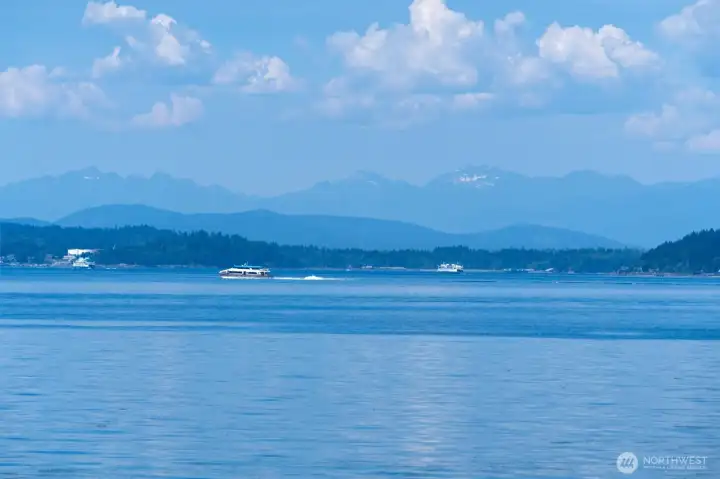 A steady stream of marine traffic set against the backdrop of the Olympic Mountains. A steady stream of marine traffic set against the backdrop of the Olympic Mountains.
