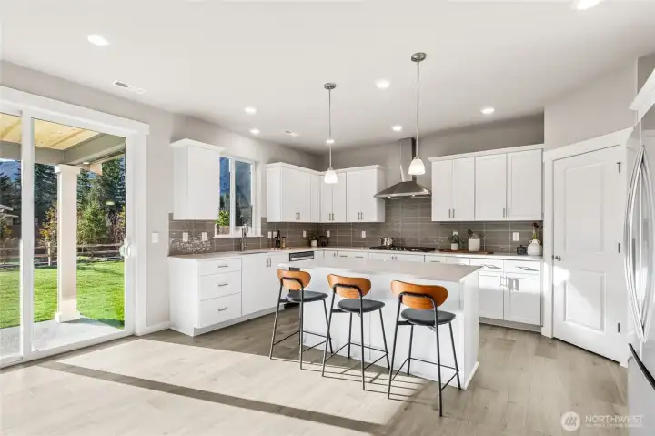 Oversized slider to fenced backyard. Photo rendering is representational and may be virtually staged. Actual home is under construction and finishes, elevation, and paint colors may vary. See site agent for details.