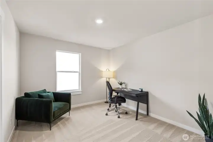 Bedroom or Office on main conveniently located near 3/4 bathroom with shower. Photo rendering is representational and may be virtually staged. Actual home is under construction and finishes, elevation, and paint colors may vary. See site agent for details.