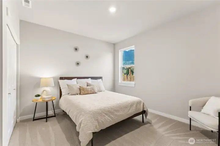 Bedroom 2 with walk in closet. Photo rendering is representational and may be virtually staged. Actual home is under construction and finishes, elevation, and paint colors may vary. See site agent for details.