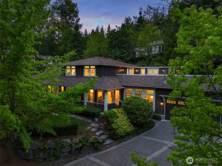 Embraced by the lush greenery of The Reserve at Yarrow Bay, this private retreat offers rare seclusion just minutes from Bellevue, Kirkland, and Seattle.