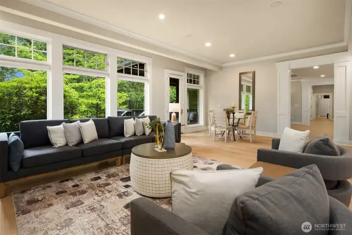 The family room features a wall of windows with access to the covered porch, which has a gas connection for outdoor grilling.