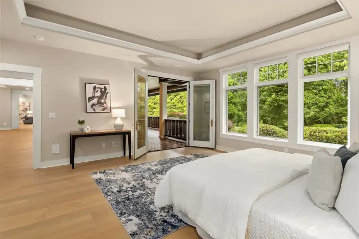 A private door opens directly to the covered deck, where mornings begin among the treetops.