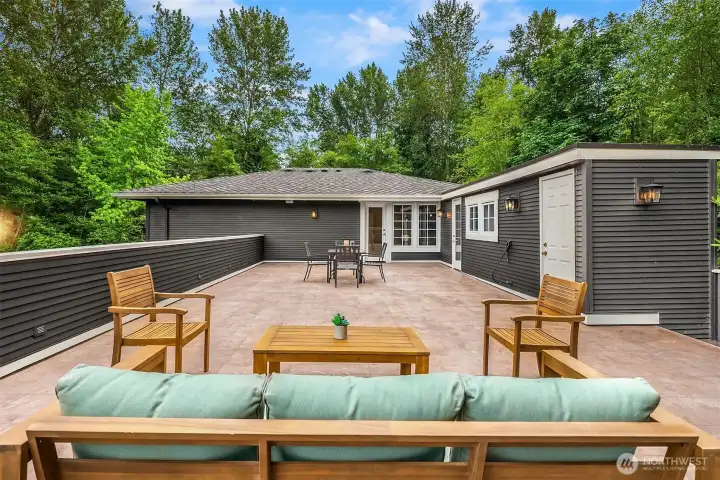 Grill-ready and fire pit-ready with a built-in gas line, two access points from the home, and a storage closet tucked just inside - this deck was built to be used. A dedicated hot tub-ready area sits just adjacent.