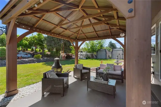 Pergola and patio offer great space to sit and enjoy morning coffee, relaxing evening dinners in this private mature landscaped back yard.