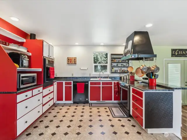 Tons of counter space and storage in this large kitchen.