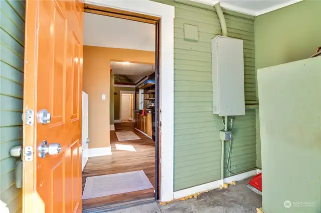 A small covered porch leads to the back door.