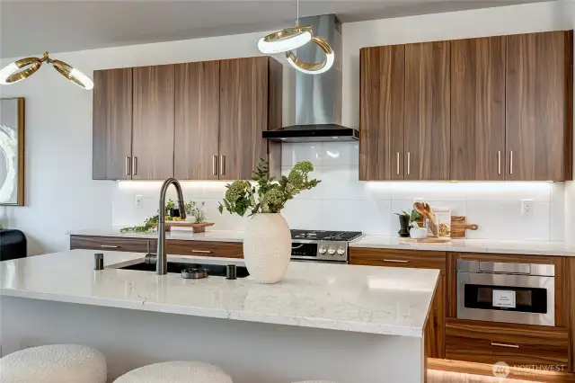 Massive island with dedicated eating space (model home lot 1A, colors may vary)