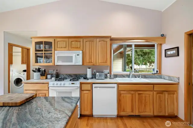 Another view of the kitchen with a peek of the laundry room