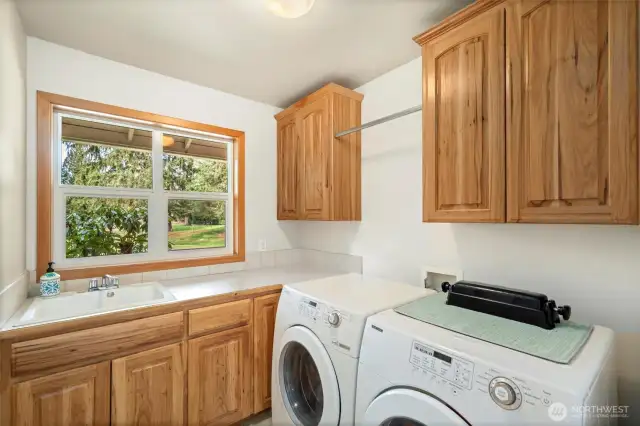 Good size laundry room adjacent to the kitchen