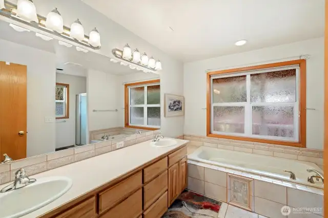 Attached primary bath with soaking tub and separate shower. And walk in closet is adjacent to this too