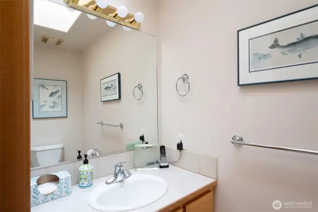 A half bath on the main floor between the kitchen and attached garage