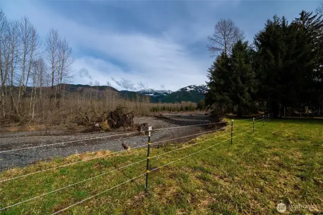 This gorgeous property is nestled along the shores of the Nooksack River. Fully fenced.