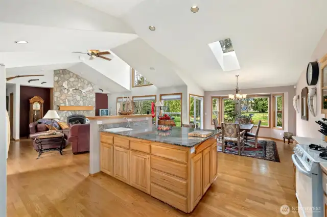 A large kitchen with massive island with bar seating.